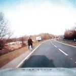 Watch the moment a Police officer rides a bicycle on the A14 after recovering it from lane 2