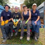 UK Power Network Staff roll up sleeves to help in the Great Churchyard