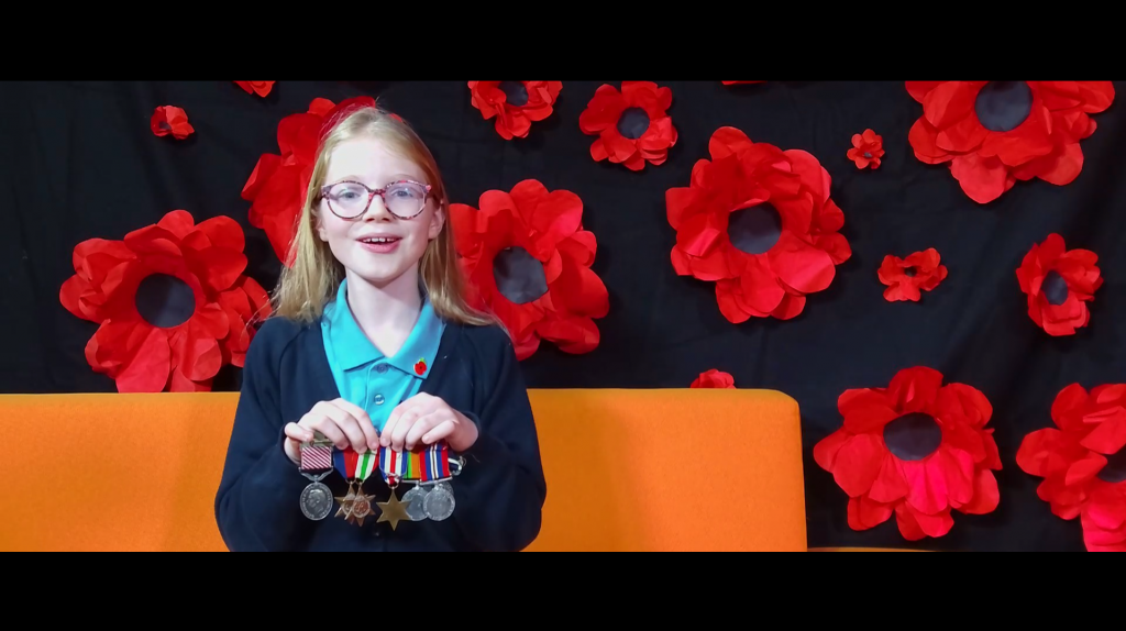 Still image from the documentary of Lilia in Year 7 showing her Great Grandad’s medals